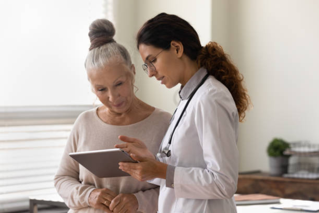 Elderly woman consulting with a healthcare professional about PHP treatment options. Personalized Thousand Oaks PHP treatment services.