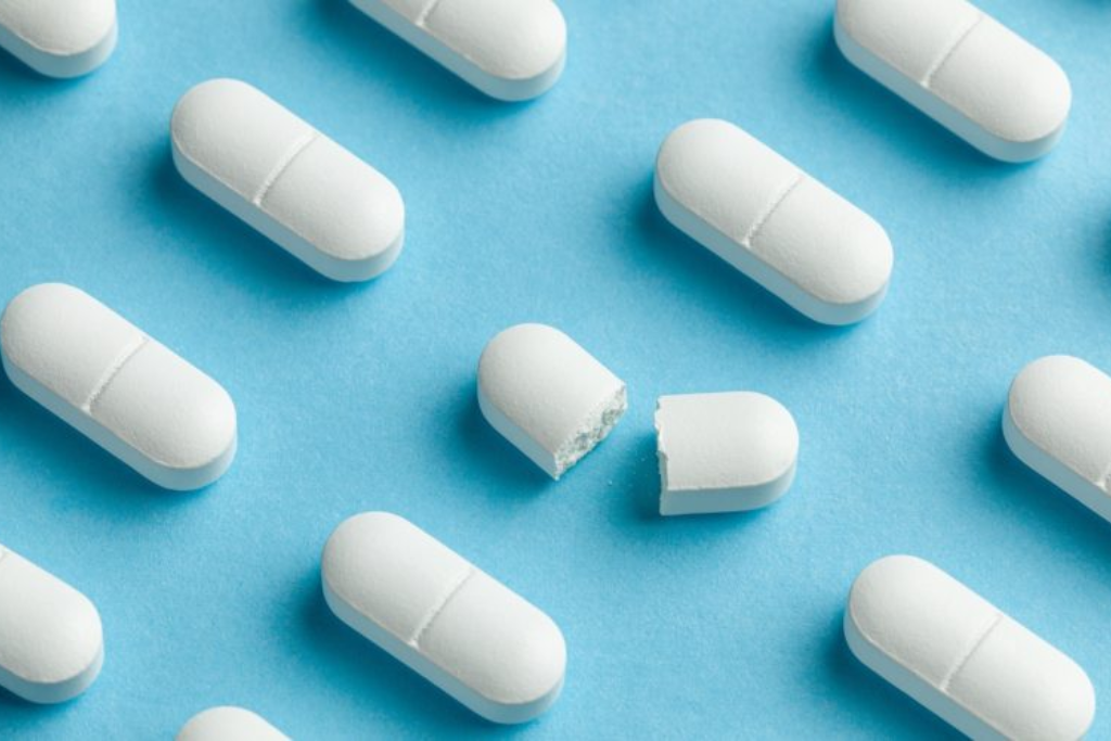 White Xanax pills on a blue background, representing the need for Xanax addiction treatment in Thousand Oaks, CA.